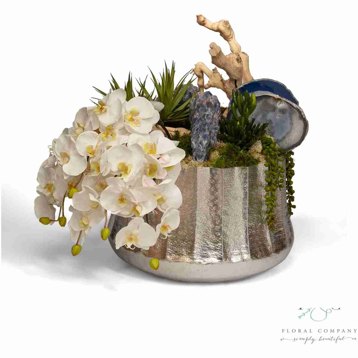 Draped Orchids In Silver Embellished Container With Blue Calcite - 27L X 18W X 21H Floral Arrangement